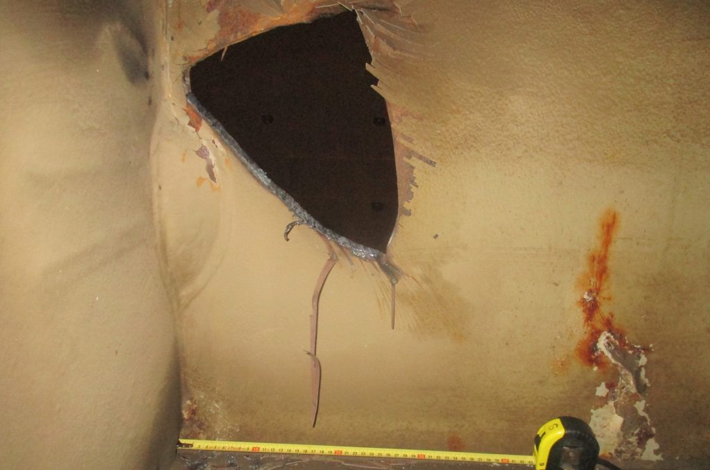 Structural damage viewed from inside the adjacent starboard ballast tank