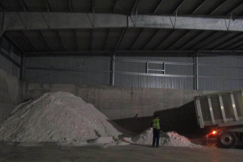 Wet soda ash segregated following discharge operations.
